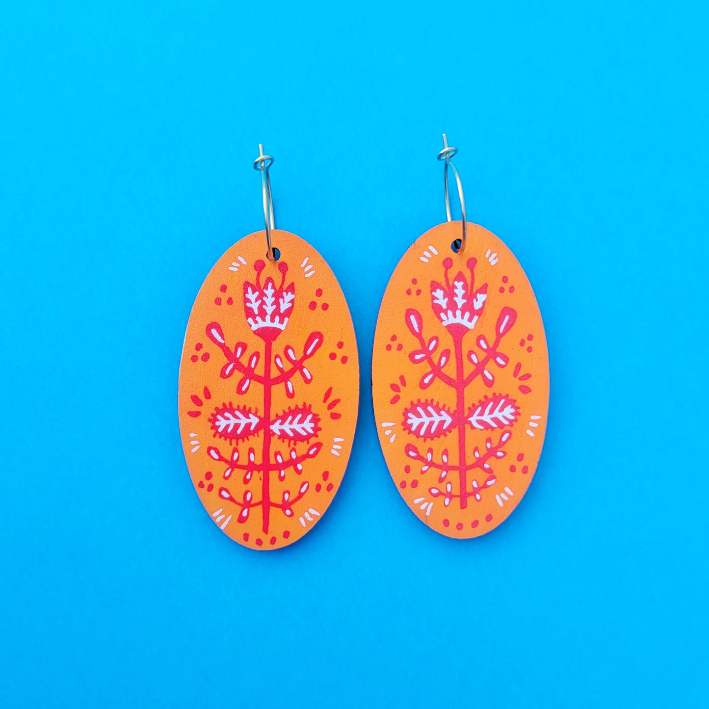 Orange folk earrings